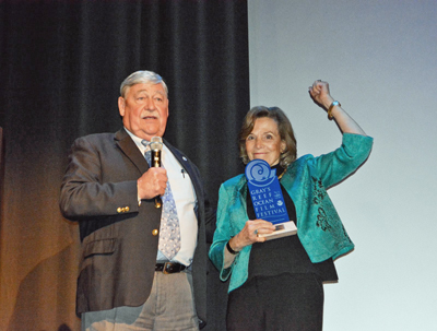 Sylvia Earle receives a Lifetime Achievement Award on stage with Billy Causey, Southeast Regional Director of the Office of National Marine Sanctuaries.